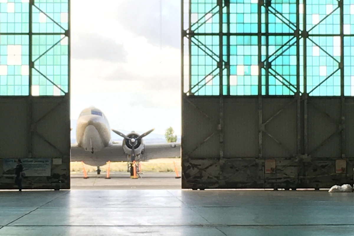 General aviation aircraft parked in private hangar at regional airport