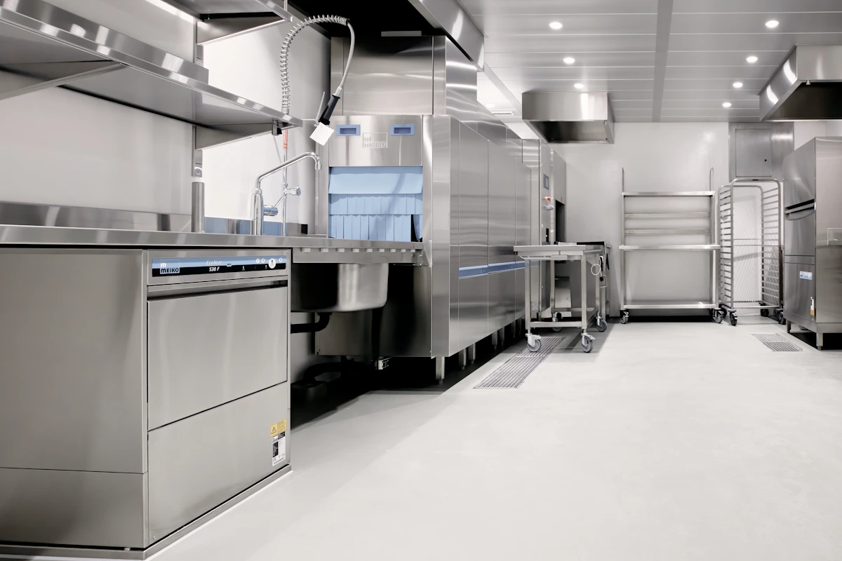 Stainless steel commercial kitchen appliances, ovens, and refrigeration systems