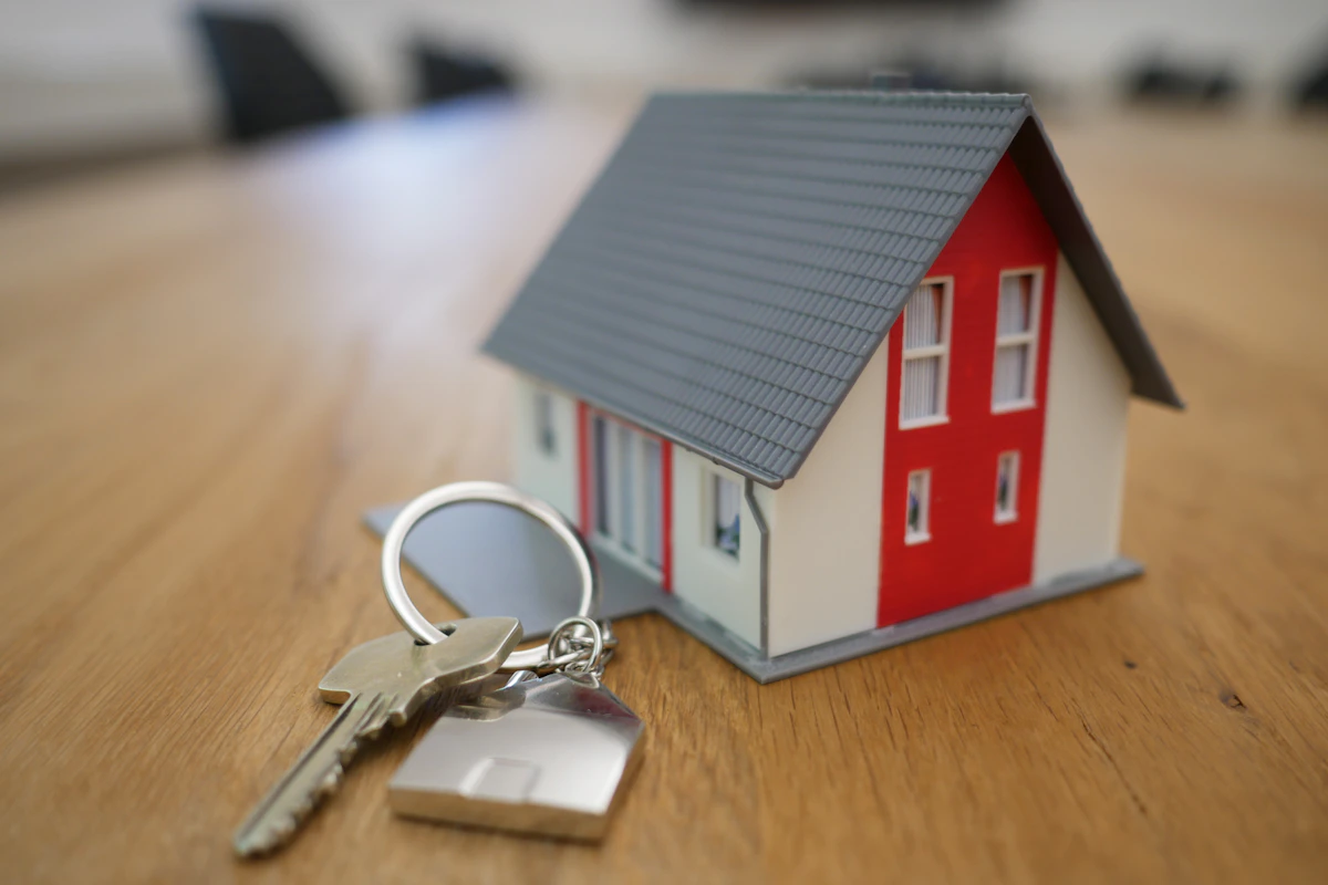 Mortgage closing table with documents and keys