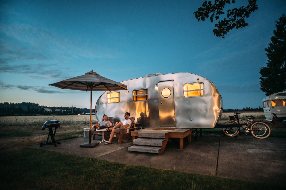 Modern recreational vehicle motorhome parked at scenic campsite