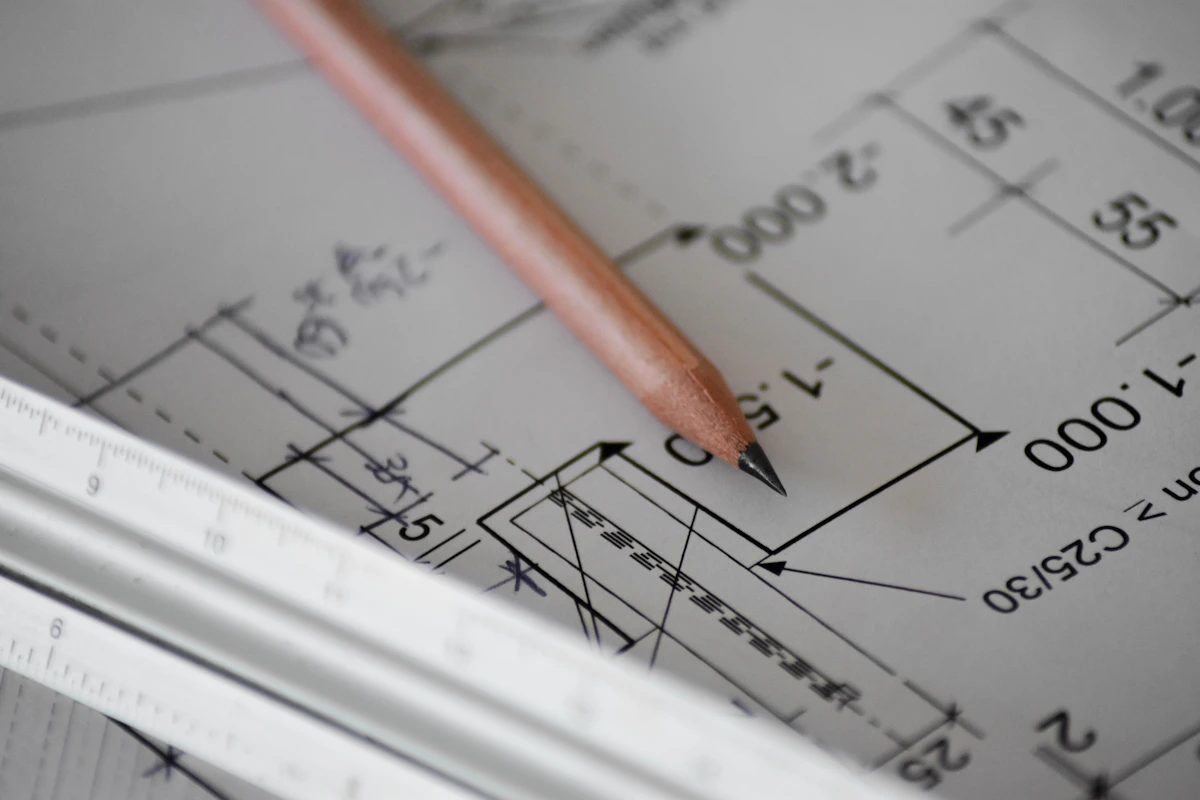 Construction contractor blueprints and architectural plans on jobsite table